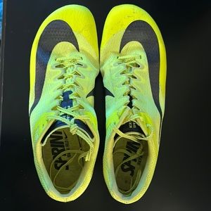 Neon yellow Nike track spikes
